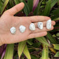 Detail shot of Grade AA Howlite tumbled stone under natural light