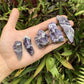 Back view of Grade AA Chevron Amethyst raw showing natural surface