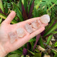 Worktop view of Fire Quartz raw crystal, from Alaotra-Mangoro, Madagascar, often kept for Focus, with subtle natural color showing through.