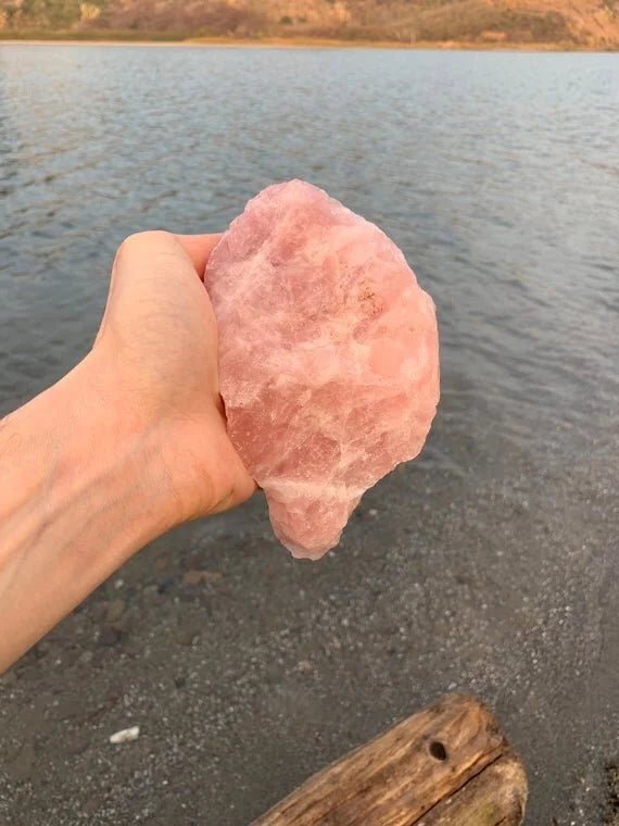 Lifestyle view of a Rose Quartz raw stone, hand-selected from Alaotra-Mangoro, Madagascar.