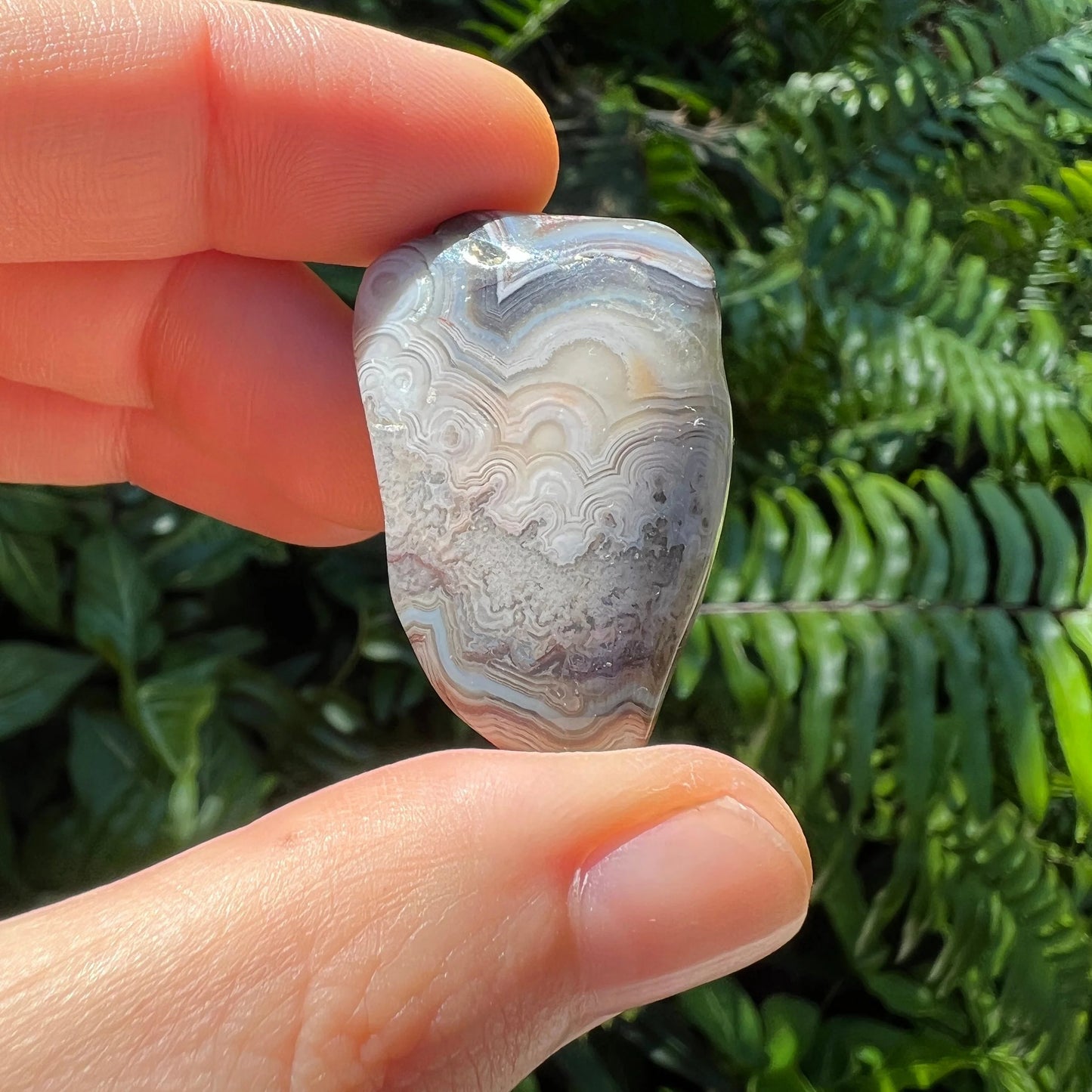 Base detail of Grade A Crazy Lace Agate tumbled stone