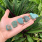 Hand-scale shot of a Amazonite raw stone, from Canada.