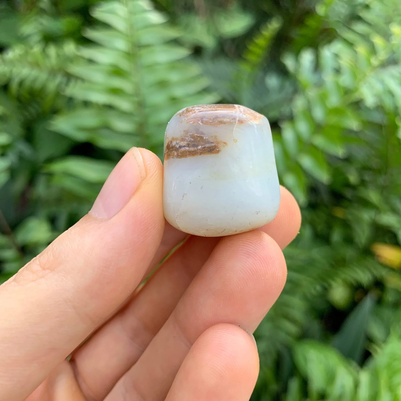 Overhead angle of Grade A Blue Opal tumbled stone, often paired with practices around Emotional Healing and Stress Relief.