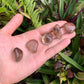 Scale reference of a Smoky Quartz tumbled stone kept near for Grounding and Protection.