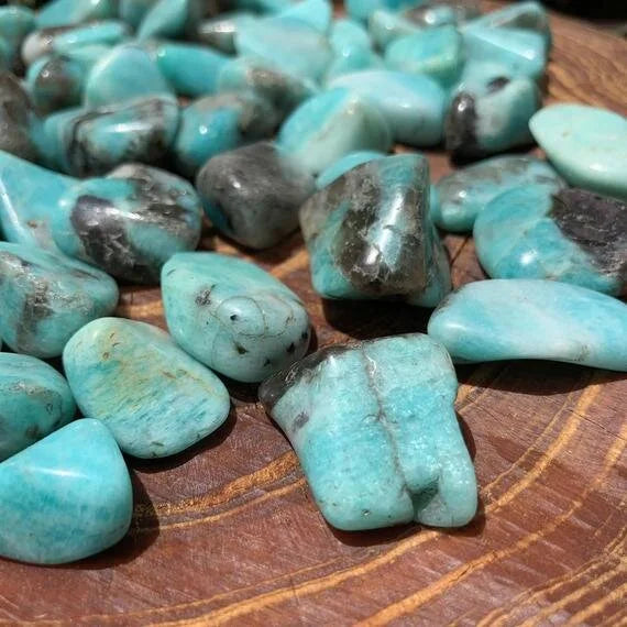 Top-side view of blue Amazonite tumbled stone, showing translucent edges.