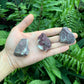 Open-palm view of Pink Tourmaline raw crystal, from Vakinankaratra, Madagascar, shown alongside the hand for scale.