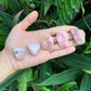 Back view of Grade A Pink Opal tumbled stone showing natural surface