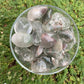 Held in hand, a Lodolite tumbled stone traditionally used for Dreaming.