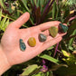 In context of an Ocean Jasper tumbled stone, from Sofia, Madagascar, often kept for Emotional Healing, shown in its everyday setting.