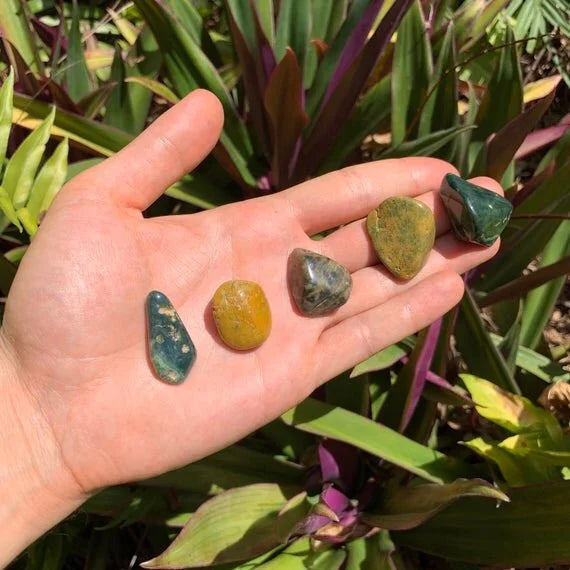 In context of an Ocean Jasper tumbled stone, from Sofia, Madagascar, often kept for Emotional Healing, shown in its everyday setting.