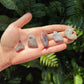 Detail shot of Grade A Crazy Lace Agate tumbled stone under natural light