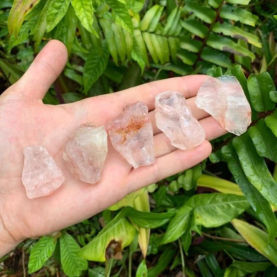 Hand-scale shot of a single Fire Quartz raw stone from Alaotra-Mangoro, Madagascar.
