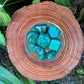 Field-of-view of Malachite tumbled stone, from Haut-Katanga, Democratic Republic of the Congo, showing the piece in repose.
