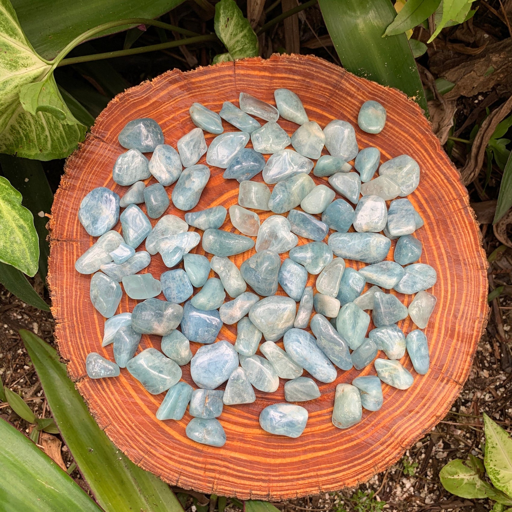 Detail shot of Grade AAA Aquamarine tumbled stone under natural light