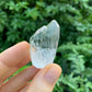 Detail shot of Grade AA Clear Quartz point under natural light