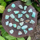 Detail of Grade A Chrysoprase tumbled stone, Brazil-sourced, showing characteristic color.