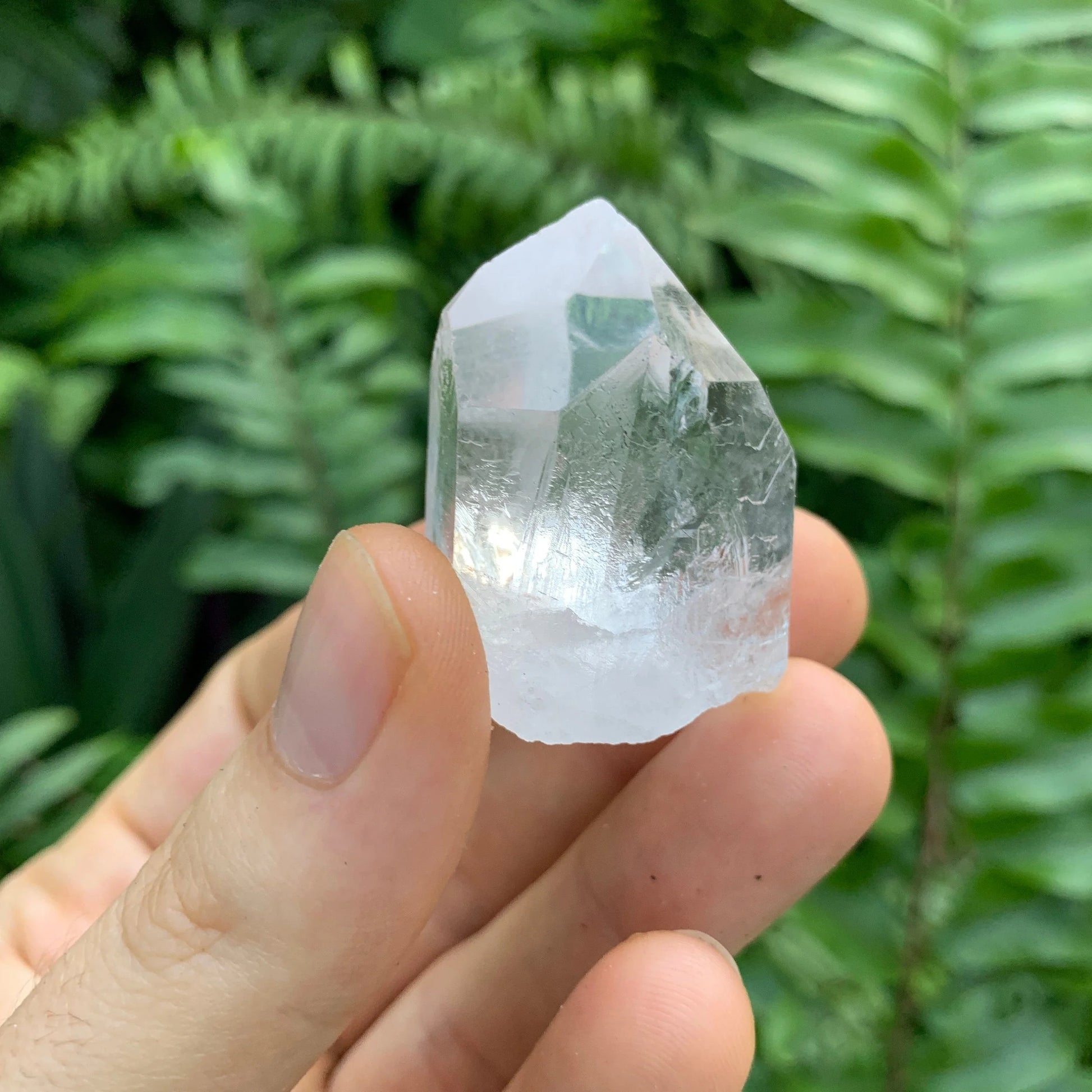 Sideways view of Grade A Clear Quartz raw point, often worked with for Cleansing, from Minas Gerais, Brazil.
