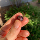 Opposite side of Garnet raw stone, showing characteristic patterning, from Minas Gerais, Brazil.