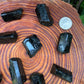 Back view of Grade AA Black Tourmaline raw showing natural surface