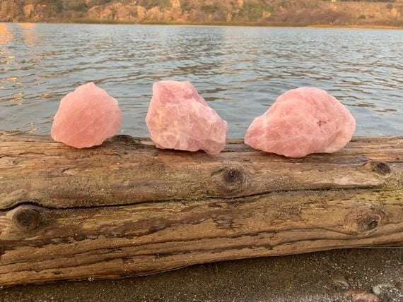 Profile view of Rose Quartz raw stone, sourced from Alaotra-Mangoro, Madagascar, drawn on for Love.
