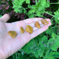 Detail shot showing Grade AA Yellow Jasper tumbled stone, showing natural inclusions, from Sofia, Madagascar.