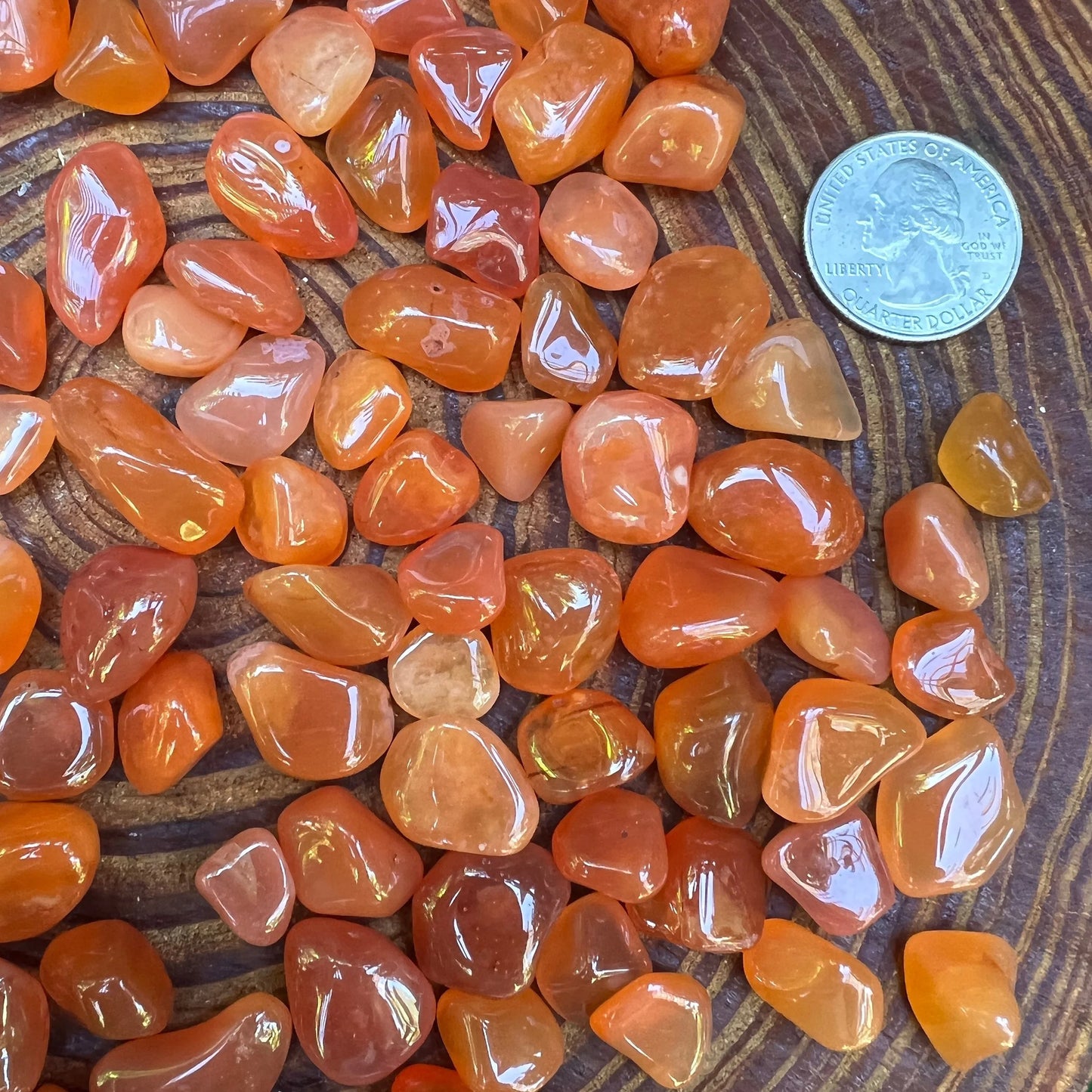 Back view of Grade AA Carnelian tumbled stone showing natural surface