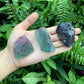 Grade aa fluorite raw held in hand for size reference