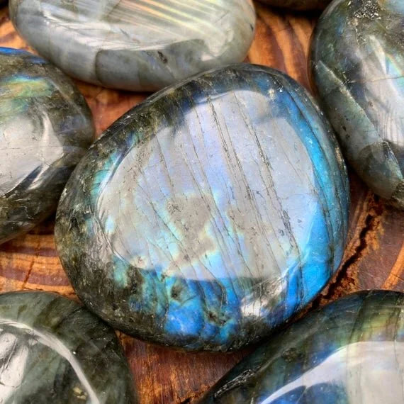 Back view of Grade AAA Labradorite palm stone showing natural surface