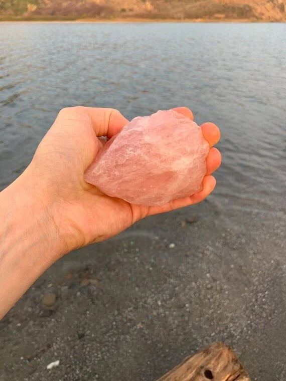 Bottom side of Grade AAA Rose Quartz raw stone, sourced from Alaotra-Mangoro, Madagascar, kept near for Love.