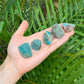 Reverse side of Grade AA Amazonite raw stone, showing natural banding.