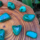 Full profile of Grade AA Malachite tumbled stone ready to ship from Beyond Bohemian