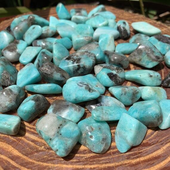 Sideways view of Amazonite tumbled stone, hand-selected from Amboasitra, Madagascar.