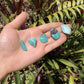Back view of Grade AA Amazonite tumbled stone showing natural surface