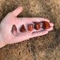 Full profile of Grade AA Red Jasper tumbled stone ready to ship from Beyond Bohemian