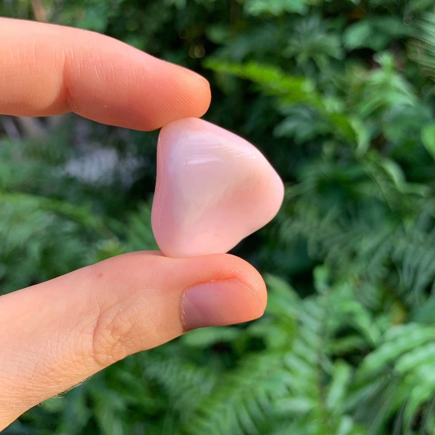 Top angle of Pink Opal tumbled stone, showing characteristic patterning, often worked with for Love and Self Love.