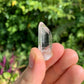 Hand-held view of a single Lemurian Quartz raw point from Colombia.
