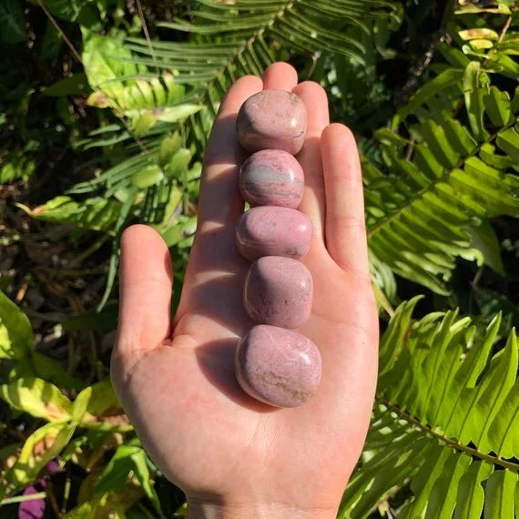 Back view of Grade AA Rhodonite tumbled stone showing natural surface