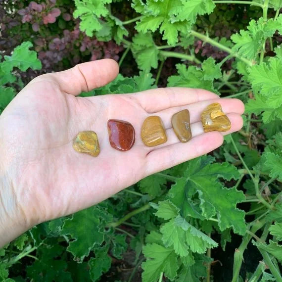 Side profile of Yellow Jasper tumbled stone, associated with Confidence.