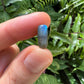Daylight detail of Labradorite tumbled stone, traditionally used for Protection, in the warmth of daylight.