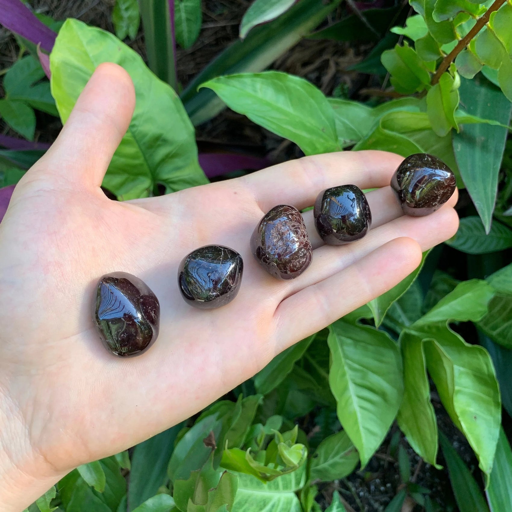 Close-up of Garnet tumbled stone from Brazil, soothing wellness stone for Confidence