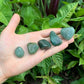 Back view of Grade AA Aventurine tumbled stone showing natural surface
