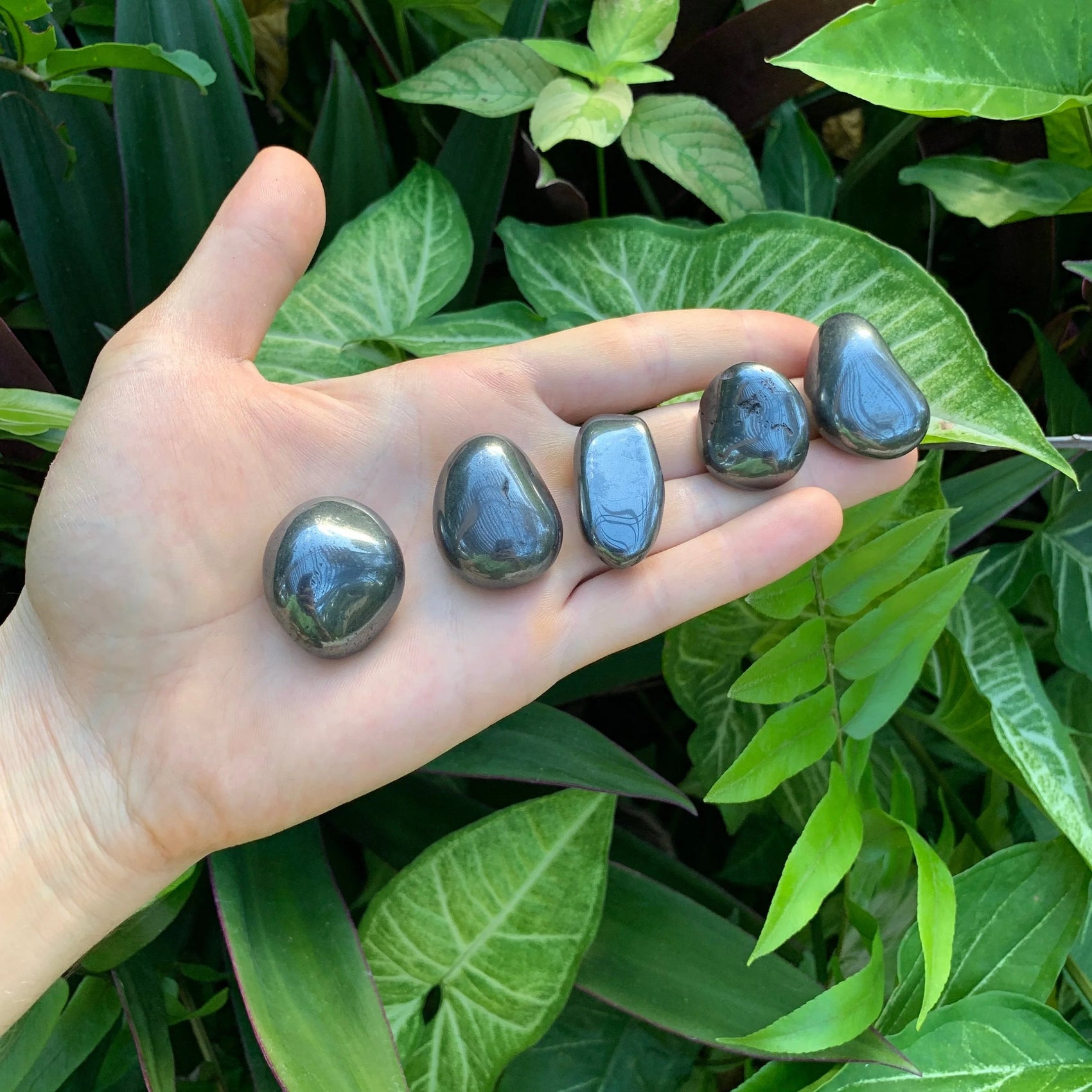Close-up of Hematite tumbled stone from Brazil, soothing wellness stone for Stress Relief