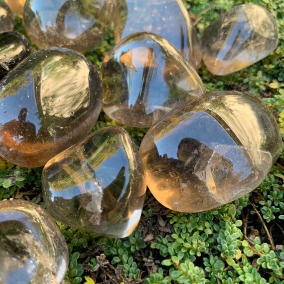Back view of Grade AAA Smoky Quartz tumbled stone showing natural surface
