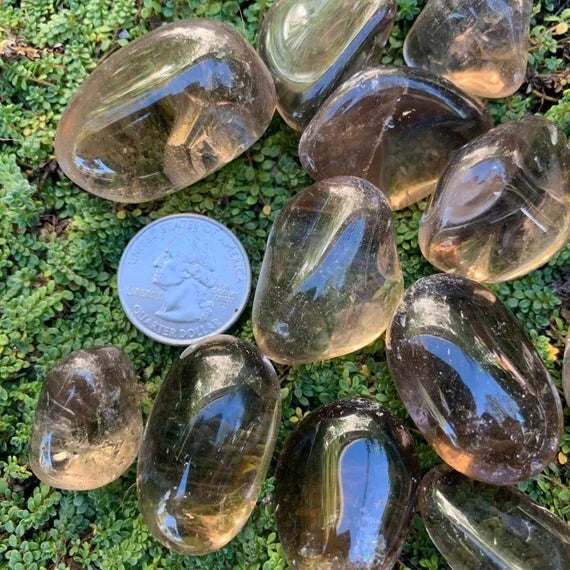Detail shot of Grade AAA Smoky Quartz tumbled stone under natural light