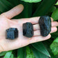 Detail shot of Grade AA Black Tourmaline raw under natural light