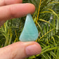 Detail shot of Grade AA Amazonite tumbled stone under natural light