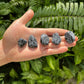 Back view of Grade AA Snowflake Obsidian tumbled stone showing natural surface
