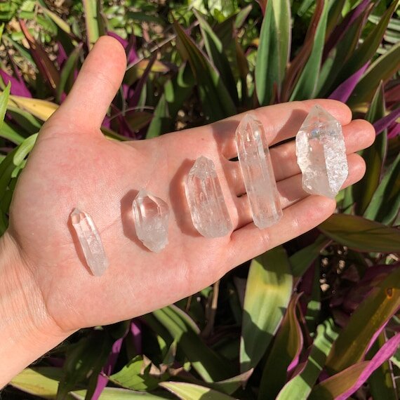 Back view of Grade AA Lemurian Quartz point showing natural surface