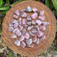 Top angle of Blue Rose Quartz tumbled stone, hand-selected from Alaotra-Mangoro, Madagascar, kept close for Stress Relief.