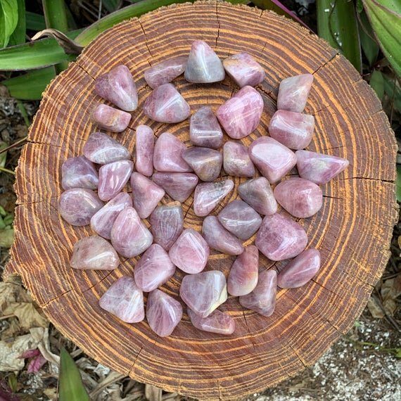 Top angle of Blue Rose Quartz tumbled stone, hand-selected from Alaotra-Mangoro, Madagascar, kept close for Stress Relief.